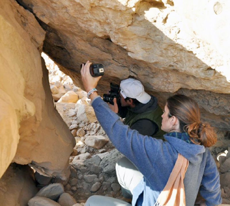 Figure 10 Photographing within the rock shrine at WH-3/EK 61