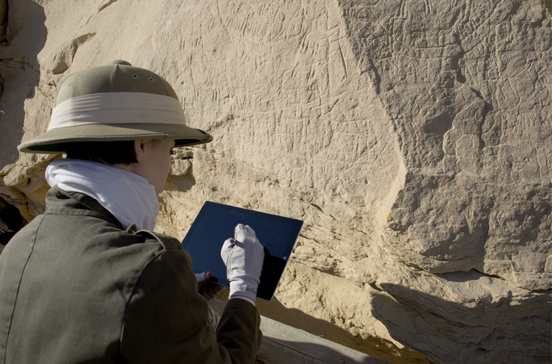 Figure 5 Using tablet computer on site to collate digital drawings of Panel 20a at the Borg el-Hamam rock inscription site (EK 77)