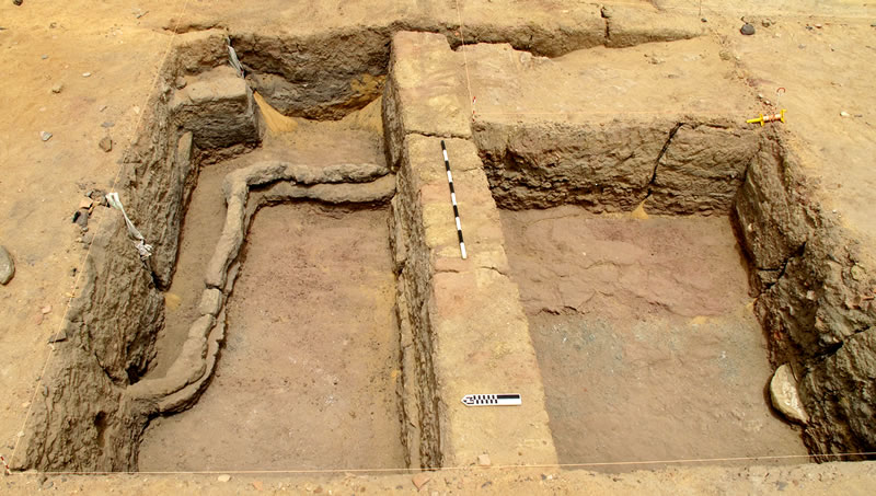 Figure 4 Square PP26 after excavation, showing the main east-west wall and the underlying sinusoidal wall.