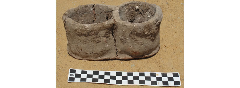 Figure 2 The most uniquitous object at Umm Mawagir — a double-bodied “cupcake” bread mold. Photo credit, Theban Desert Road Survey